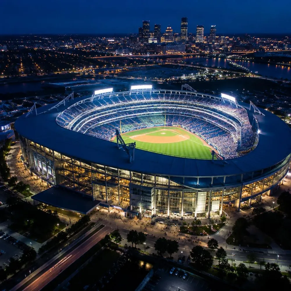 Illuminated modern sports stadium at night